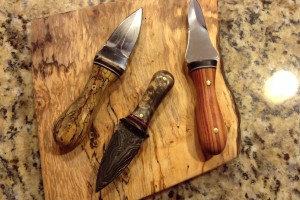 Oyster knives with spalted tamarind and Damascus steel, geeze.